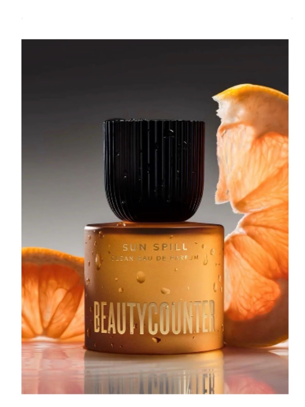 beautycounter Sun Spill Eau de Parfum - Amber Orange Bottle with Black Cap
